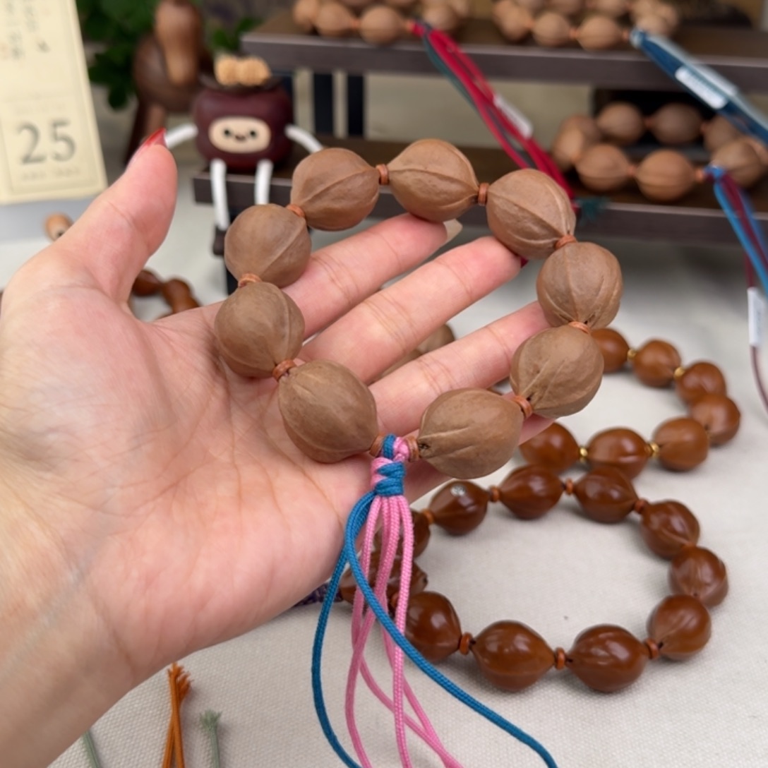 阿***吃手串橄榄核22*28三花核串