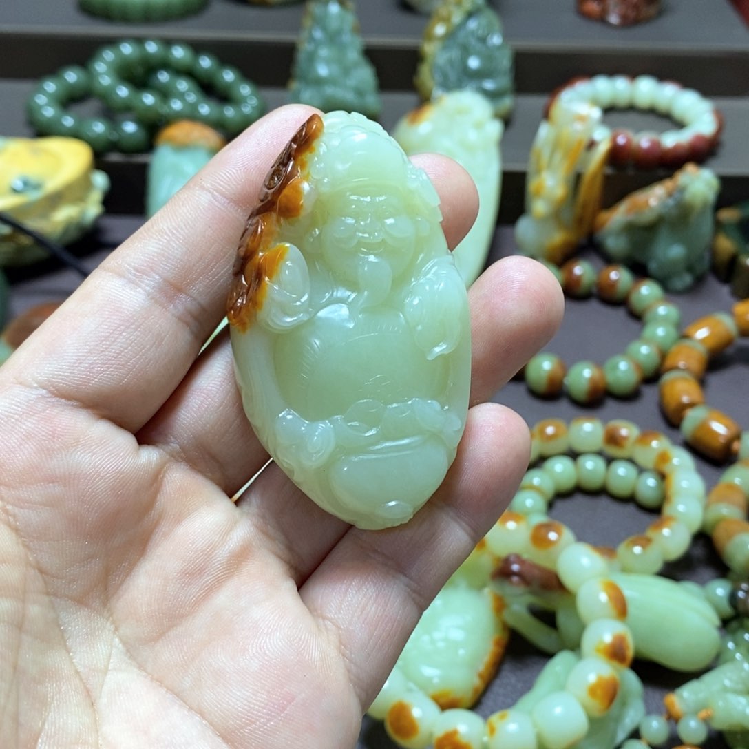 透闪石质玉财神未镶嵌橘***恼