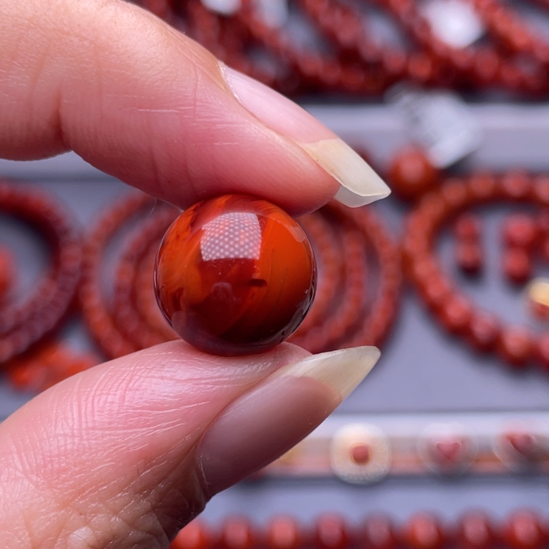 刘***亮南红玛瑙未镶嵌配珠13.2mm瓦西柿子牛血火焰高品单珠