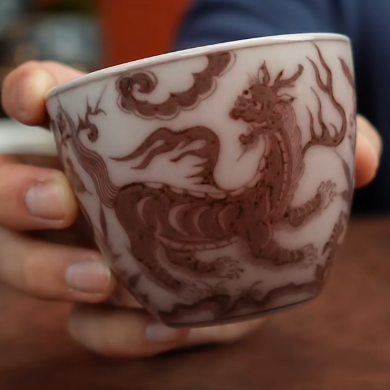 付明华制釉里红獬豸罗汉杯