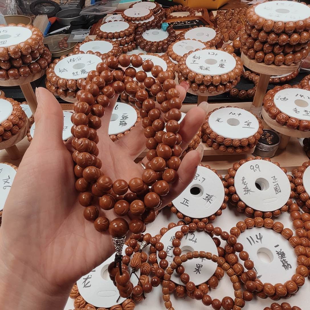 桃核手串红*汇桃核光珠