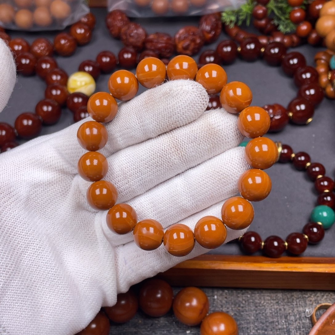 橄榄核手串传*者1.25精品1.5小孔小红核