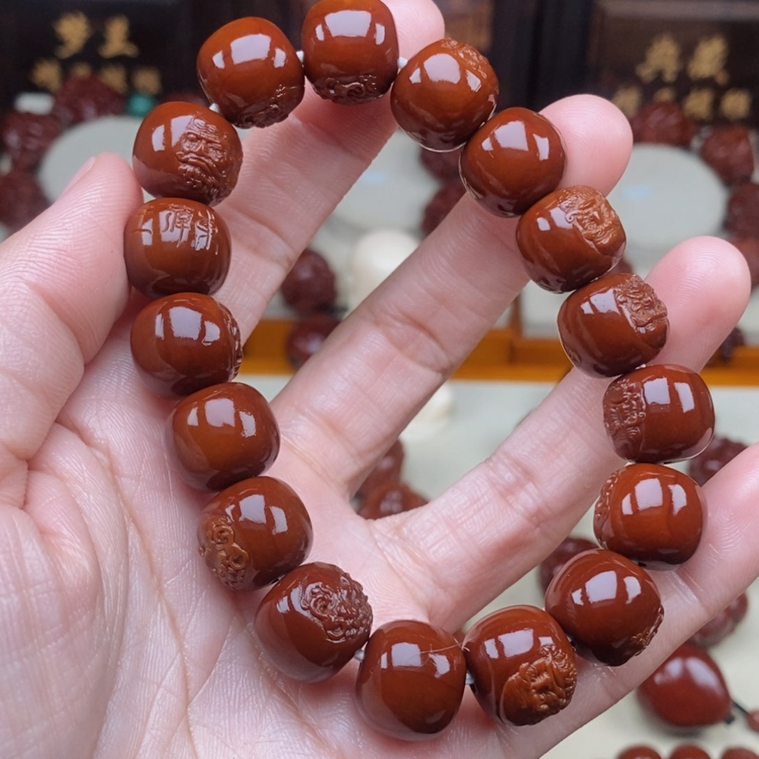 橄榄核吊坠只***水达摩达摩