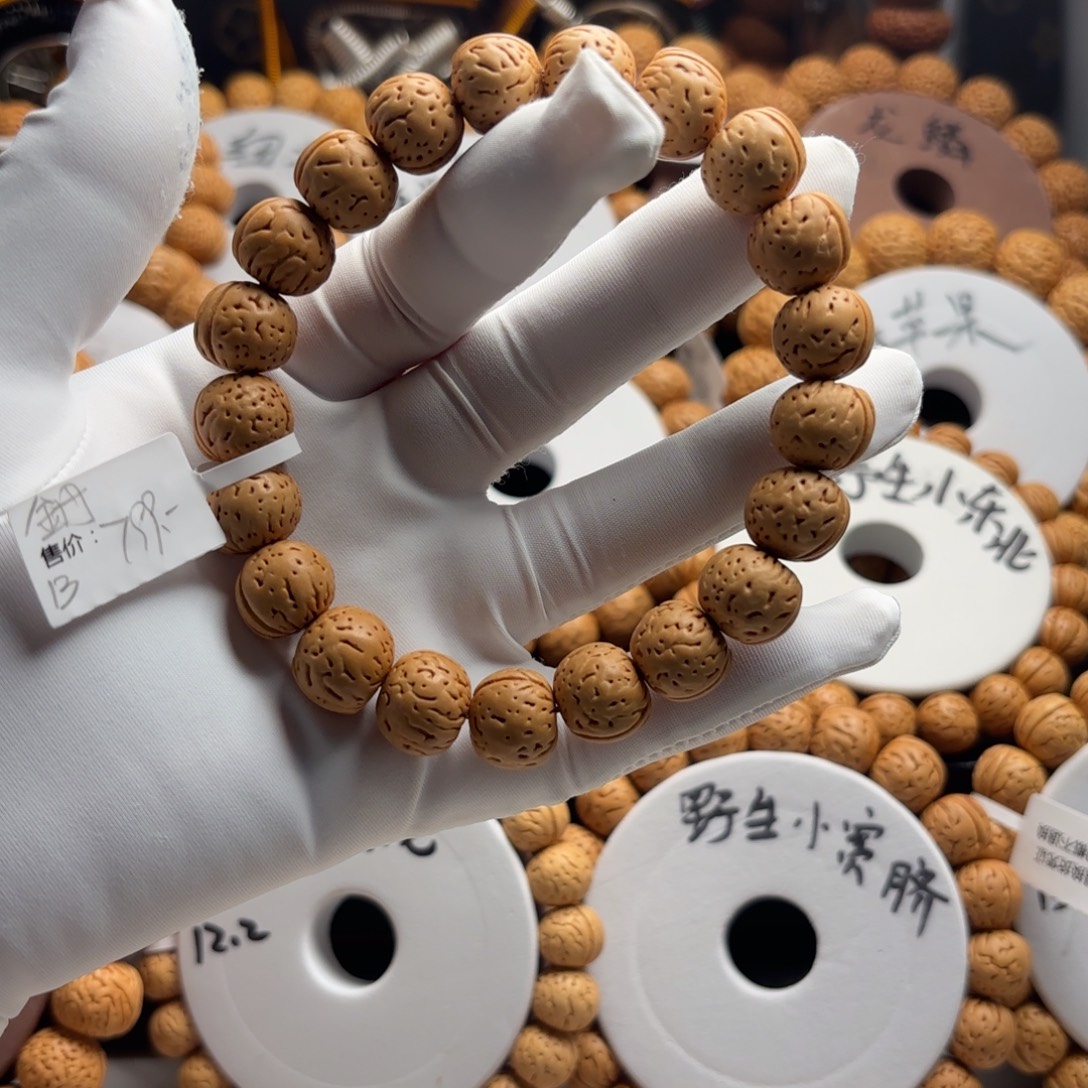 萬***缰菩提籽类金丹精品桃核手串