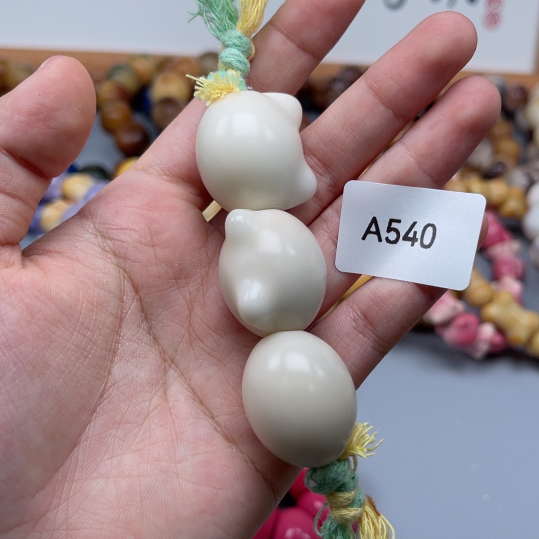 吊坠菩提根/象牙果A540猫头20-25瑕疵一串随机