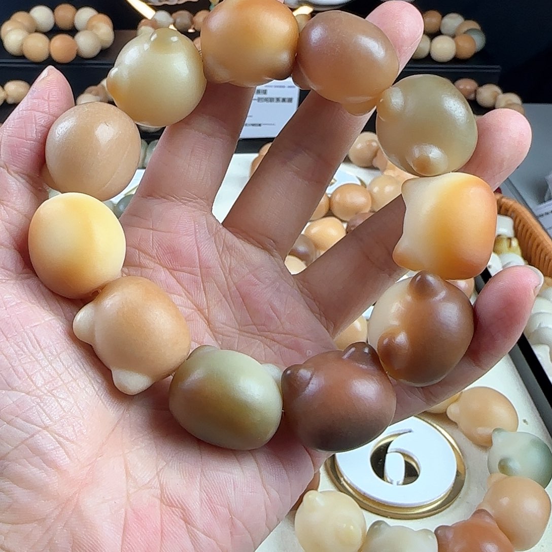 菩提根/象牙果手串一*瑕疵卡23干磨大猫头1串