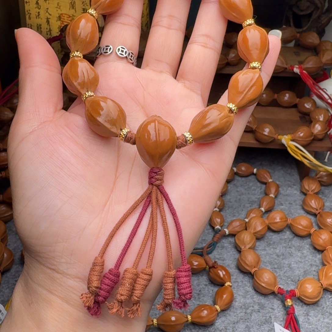 橄榄核手串1.5*23三面佛 正宗梅林铁核