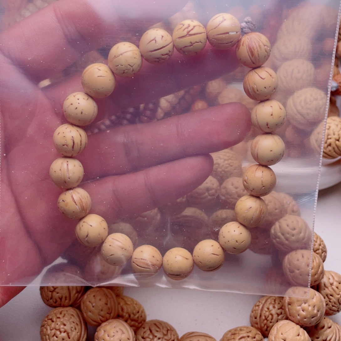 萌***熊手串桃核桃核光珠