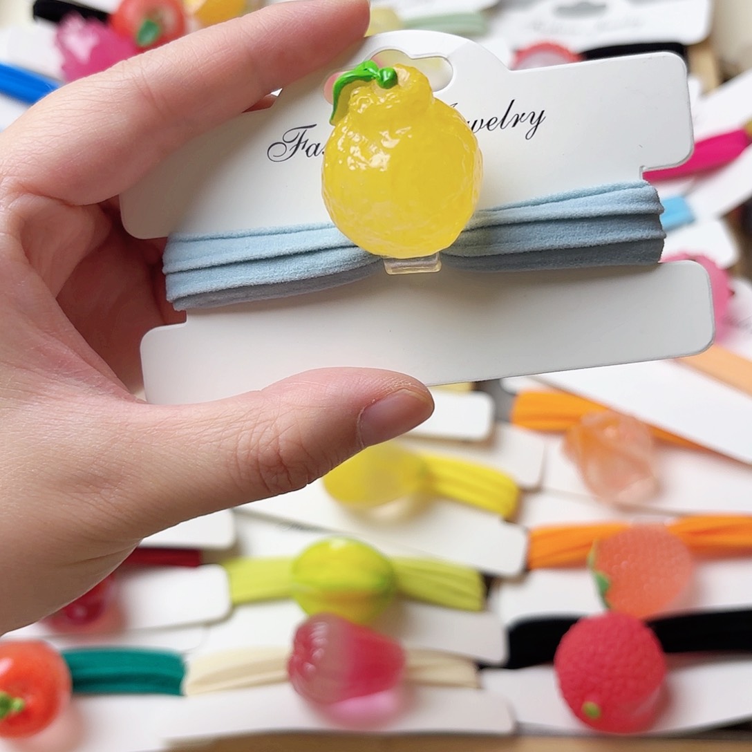 布艺非金属夜光丑橘发绳