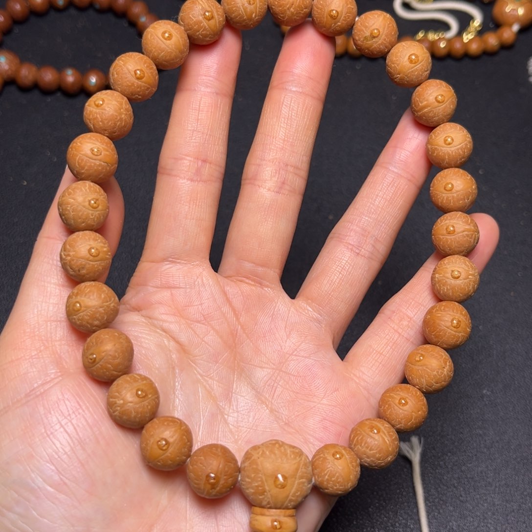 凤眼菩提吊坠12mm精品27颗手持