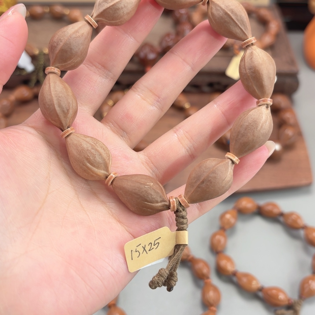 勾***手手串橄榄核三面佛