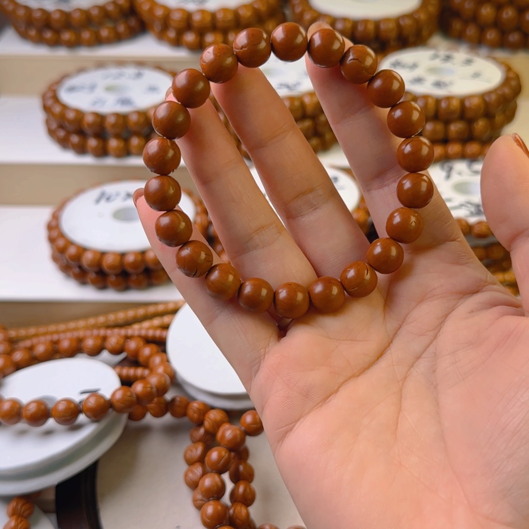 桃核手串苏***?龙纹桃核火云龙珠