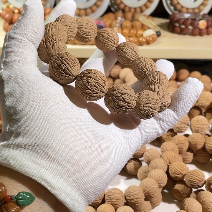 猴头核桃手串黑武士野生金丝凤羽