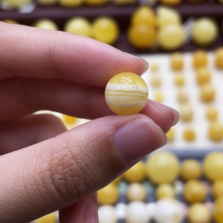 琥珀未镶嵌裸石10.9mm金白虎皮瑕