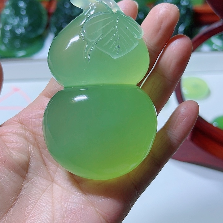 海***珊蛇纹石玉合金手把件