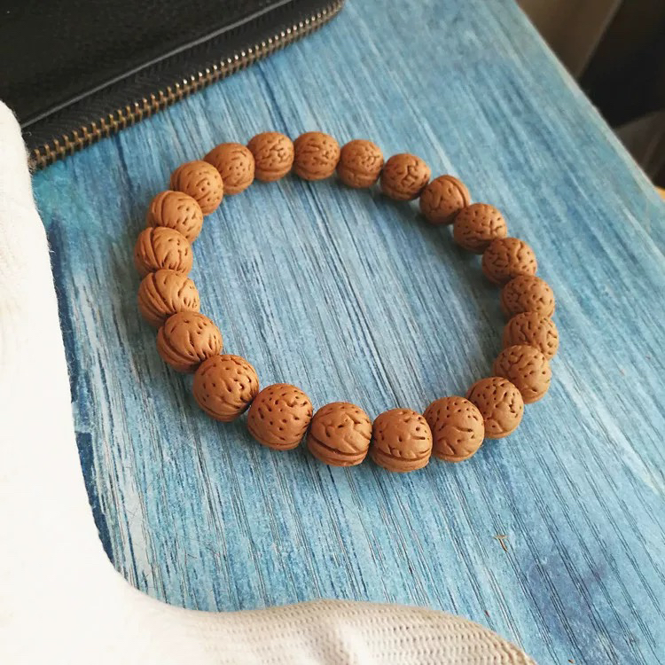 文玩桃核金丹手串精品