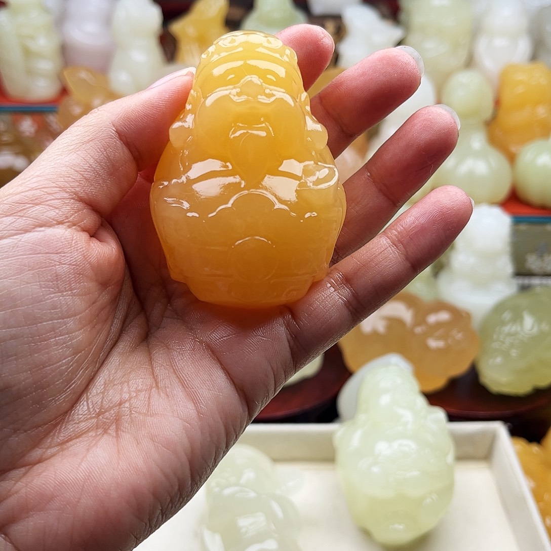 此***年石材财神手把件摆件