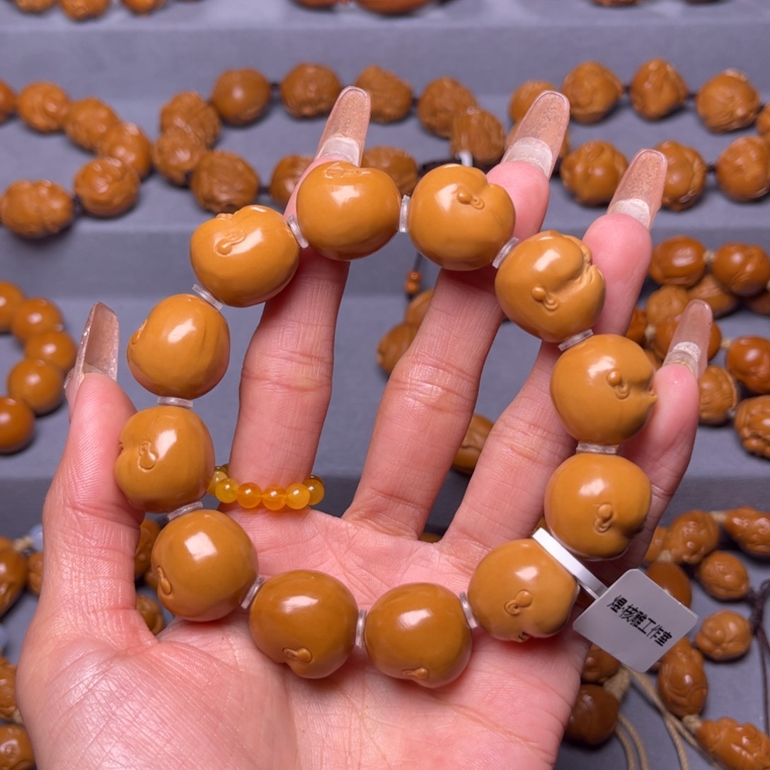 橄榄核吊坠那***开橄榄核手串