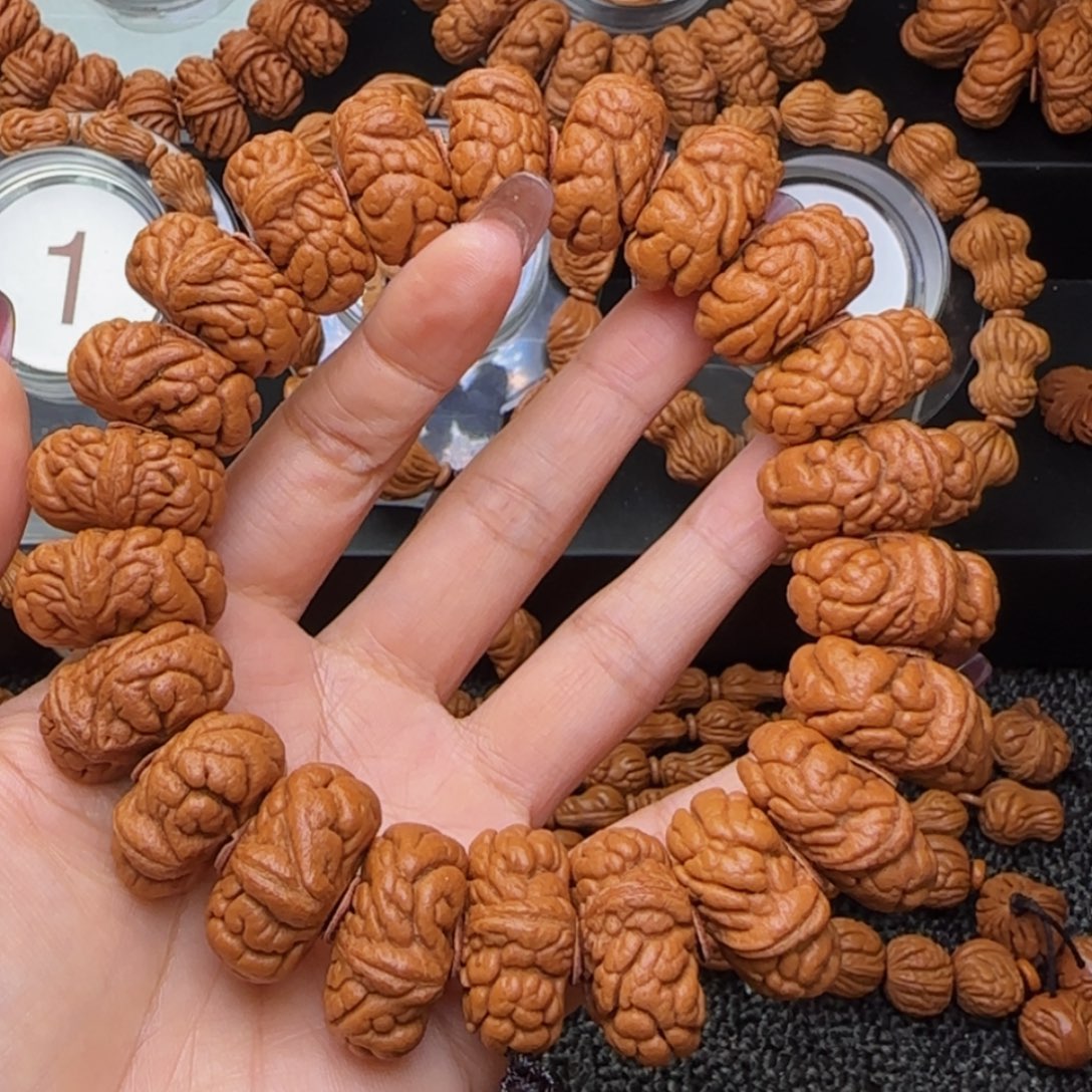 热***止桃核吊坠霸王龙手持