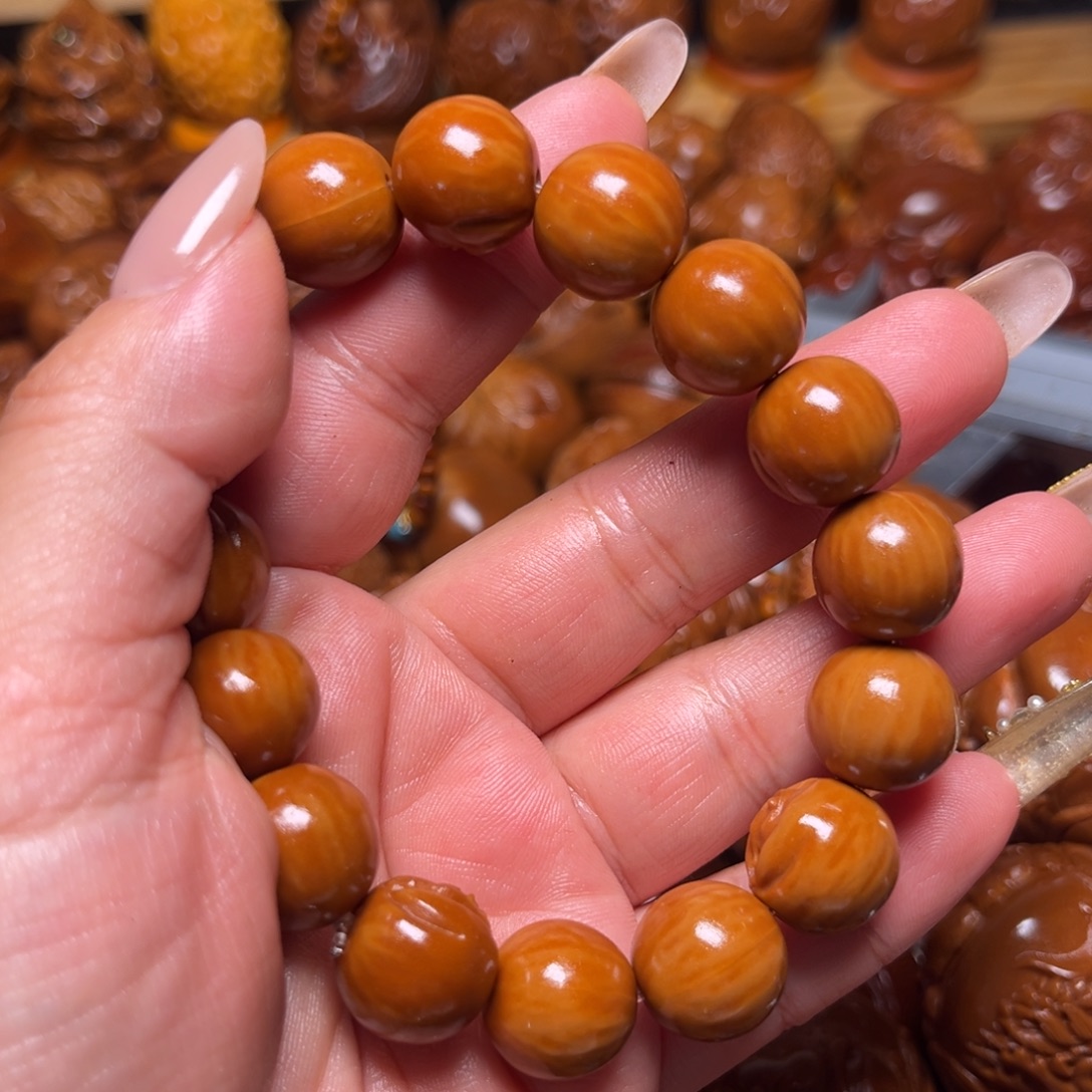 拱***猪把件橄榄核猴头串