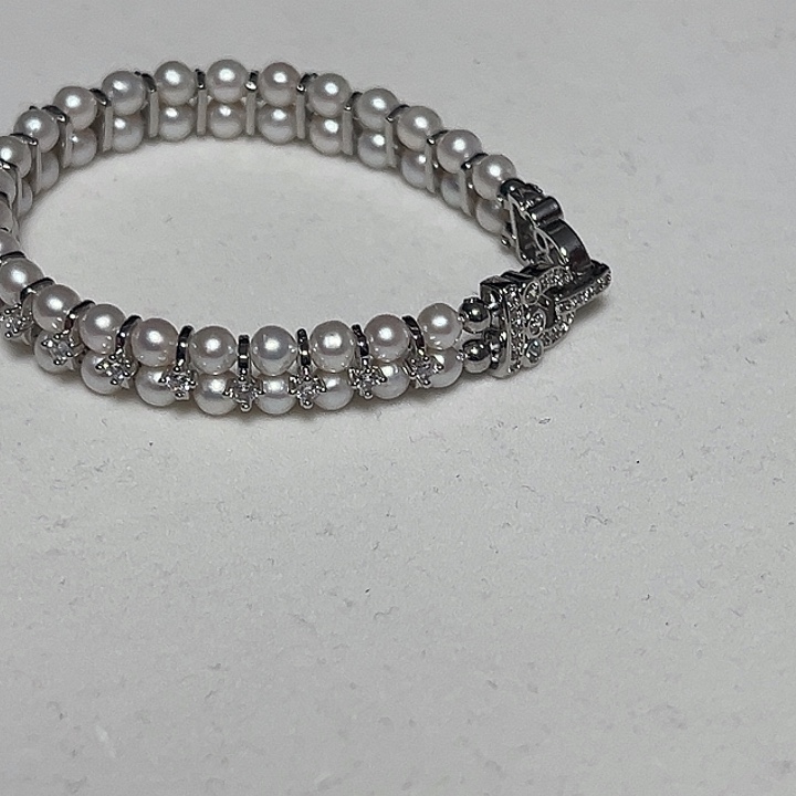 德***华手绳淡水珍珠钛钢