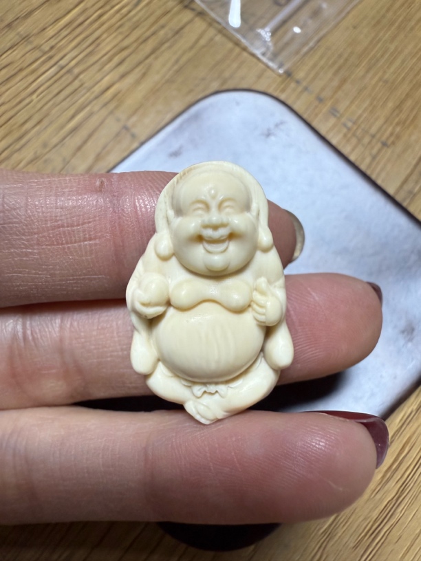 81887猛犸牙弥勒佛吊坠牌瑕疵