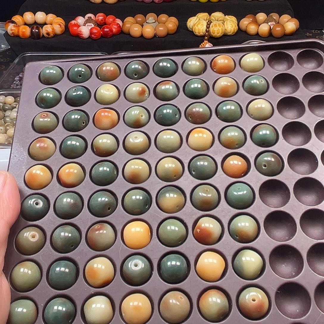 玉***琚菩提根/象牙果手串75颗瑕疵苹果