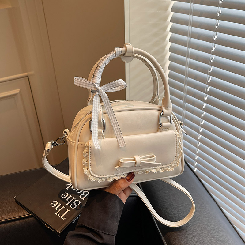 夏季超火小众蝴蝶结包包女2025新款百搭斜挎包高级感手提保龄球包