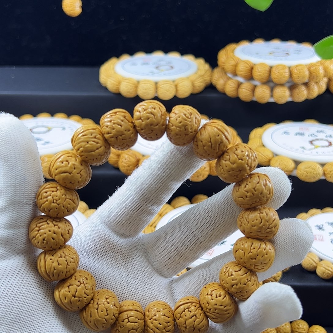 M***、桃核手串纽扣桃核手串