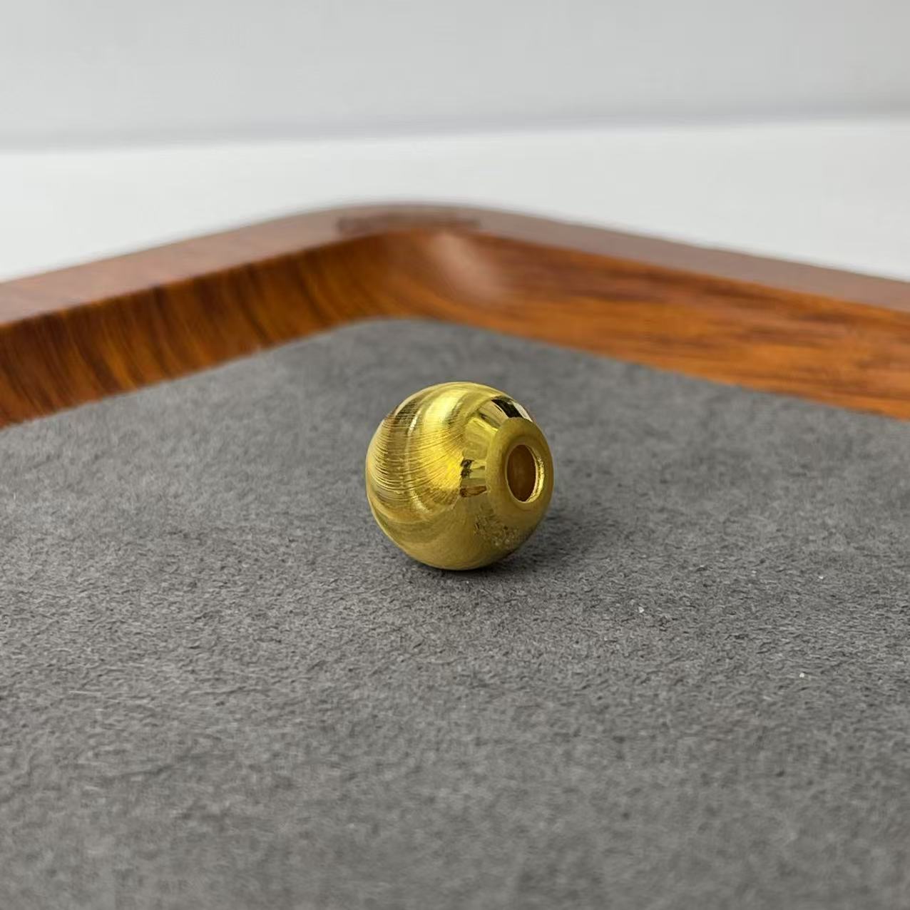 新金社黄金足金999猫眼珠12mm编绳款DP1673