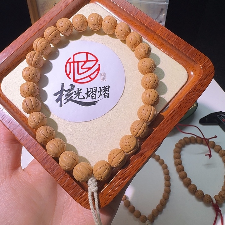 我***怡桃核吊坠野生奶油球