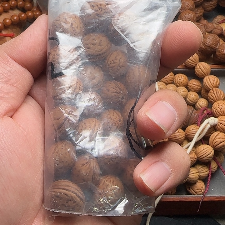 *****野生桃核钱袋子手持