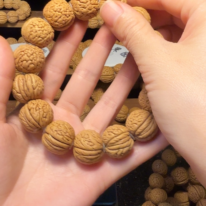 “***虎桃核吊坠盘锦肌肉