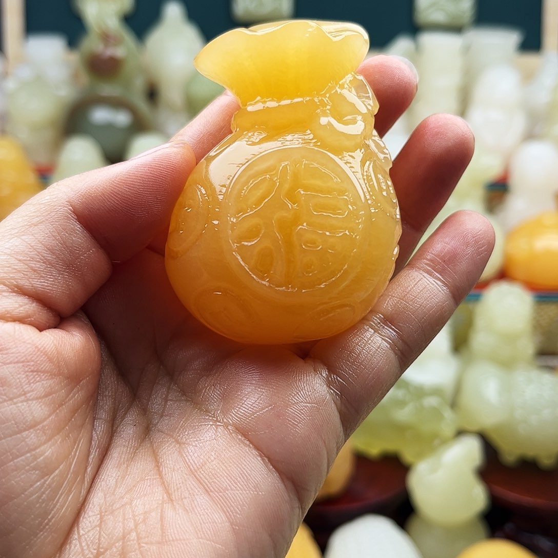 莫***颜石材福袋子手把件