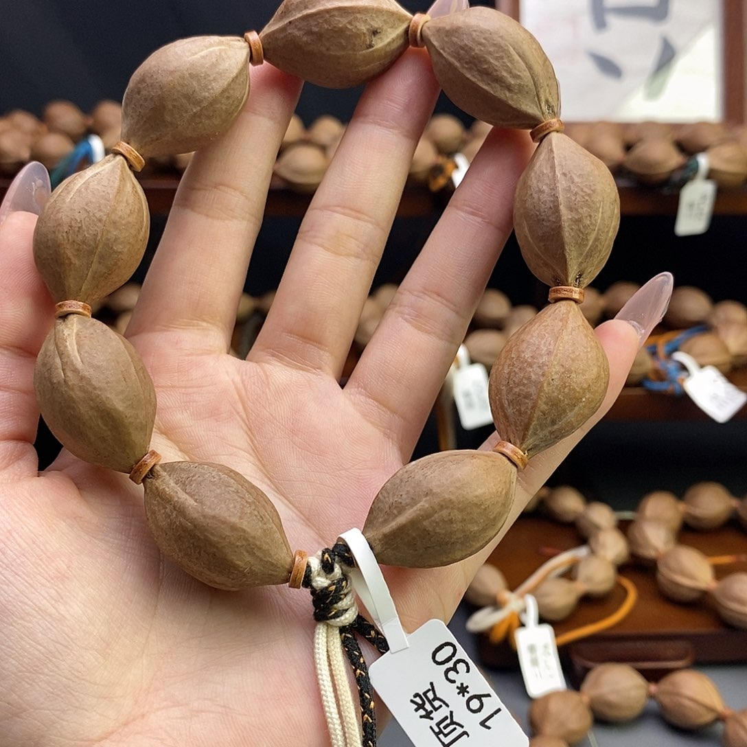 娃***哈吊坠橄榄核梅林铁核