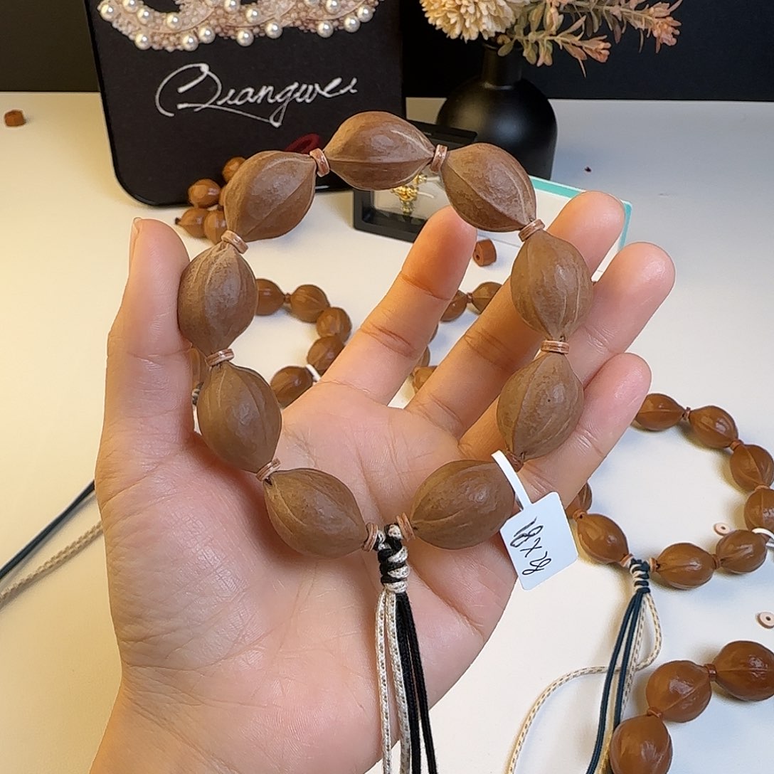 ㅤ***湫手串橄榄核梅林铁核18×28+三通