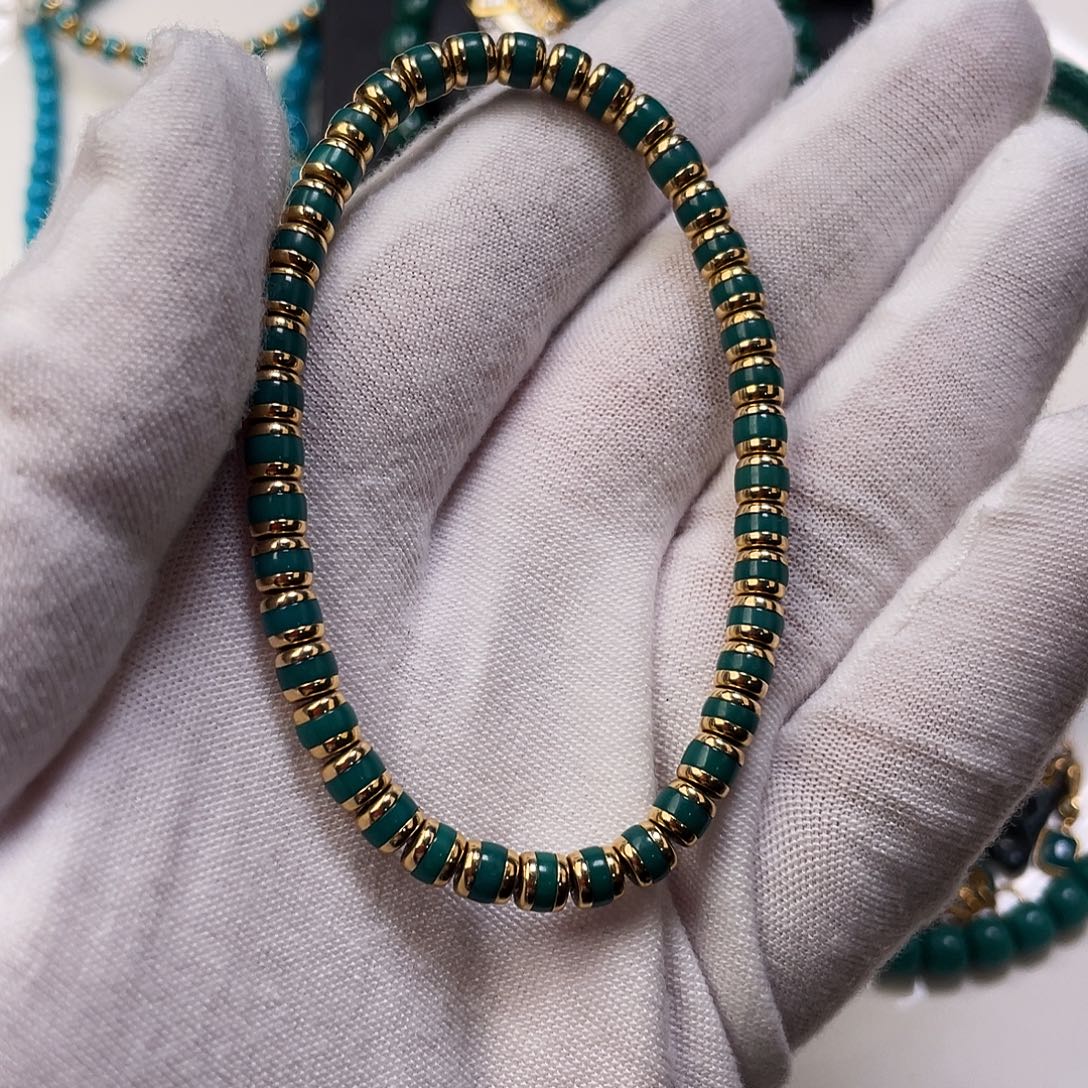 辉***仔绿松石18K金镶嵌珠宝奇石