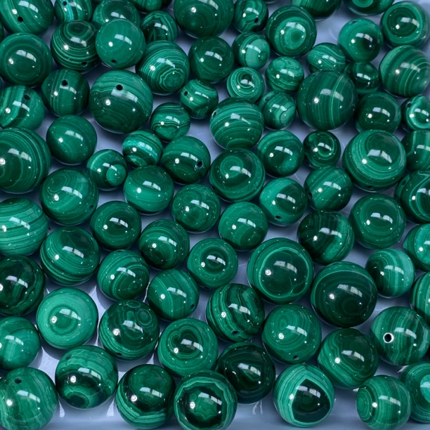 高品双眼孔雀石圆珠一颗