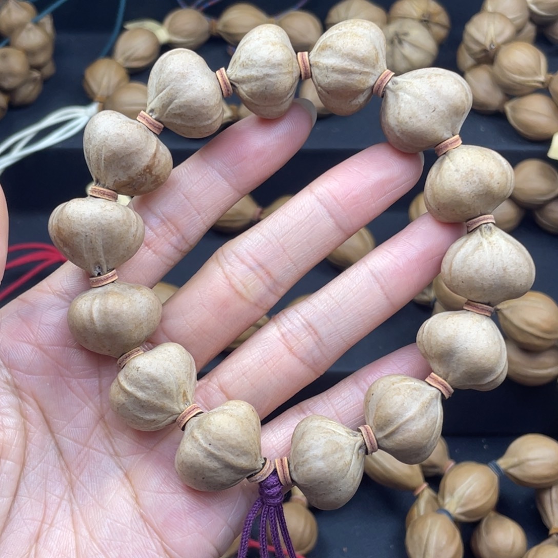 @***调003橄榄核三花蒜头20