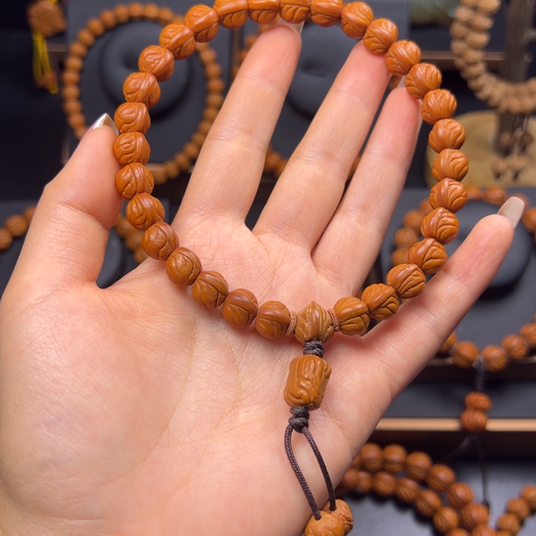 矜***。桃核手串野生玉龙脊10