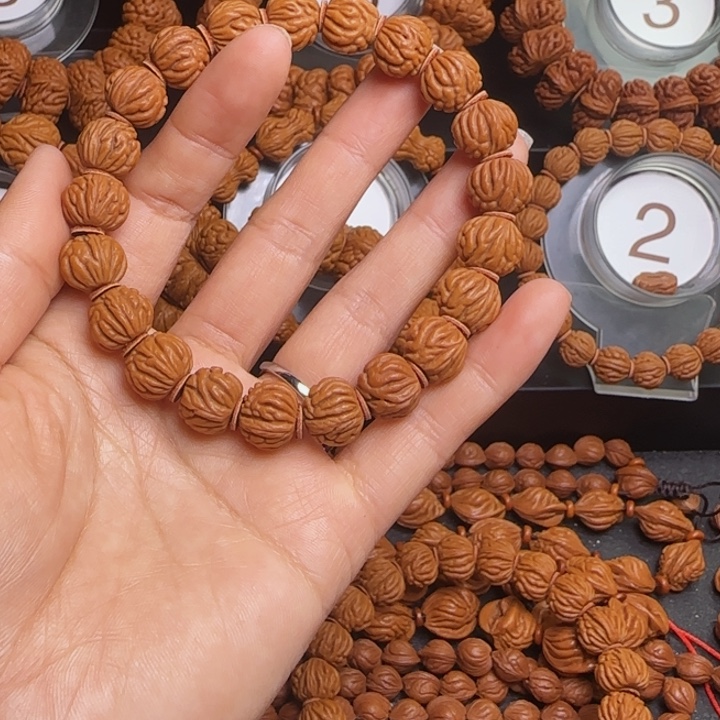 辰***轩桃核手串龙纹桃核