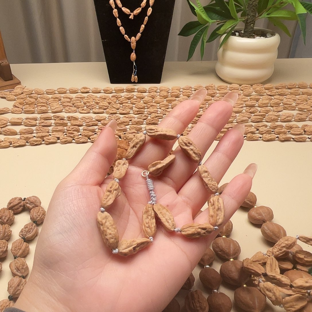 颖***儿吊坠文玩核桃异形手串