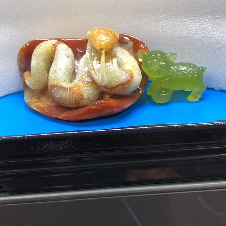 岁***声石材家居装饰摆件身缠万贯