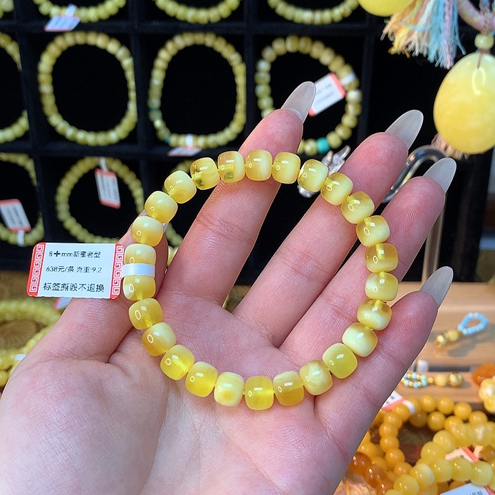 琥珀手链未镶嵌是****蜜蜡手串素圈