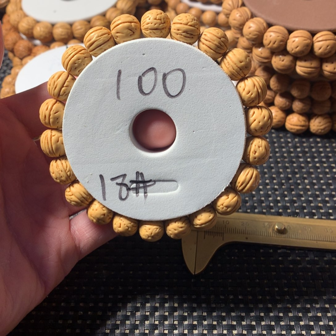 笑***i桃核手串18号链接，