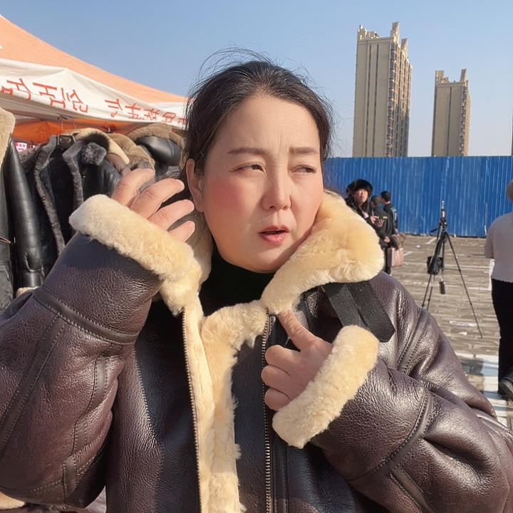 手****954棕米色戴帽款皮毛一体