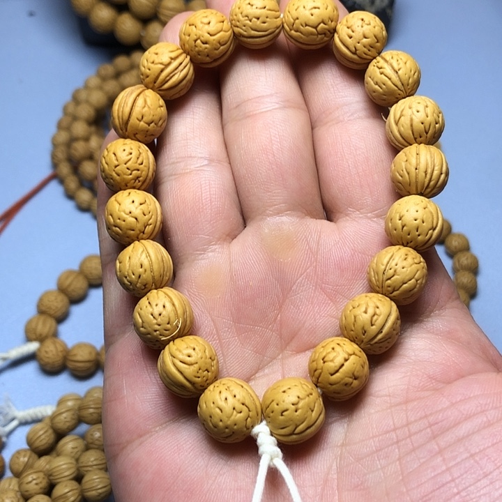 桃核吊坠野生麒麟纹金豆手持