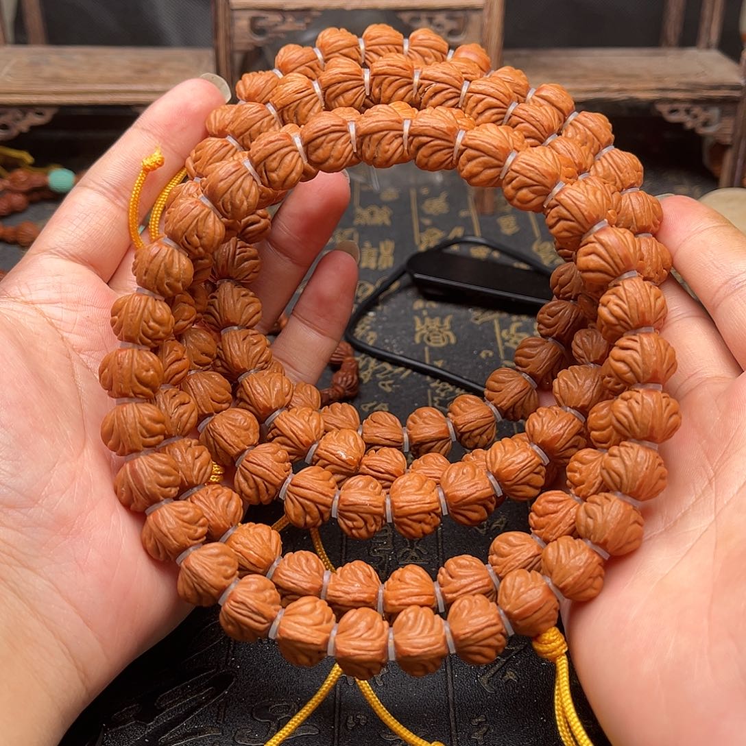 吊坠桃核三角龙手持