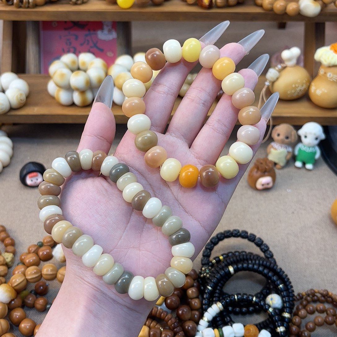 静***啊吊坠菩提根/象牙果手串两条