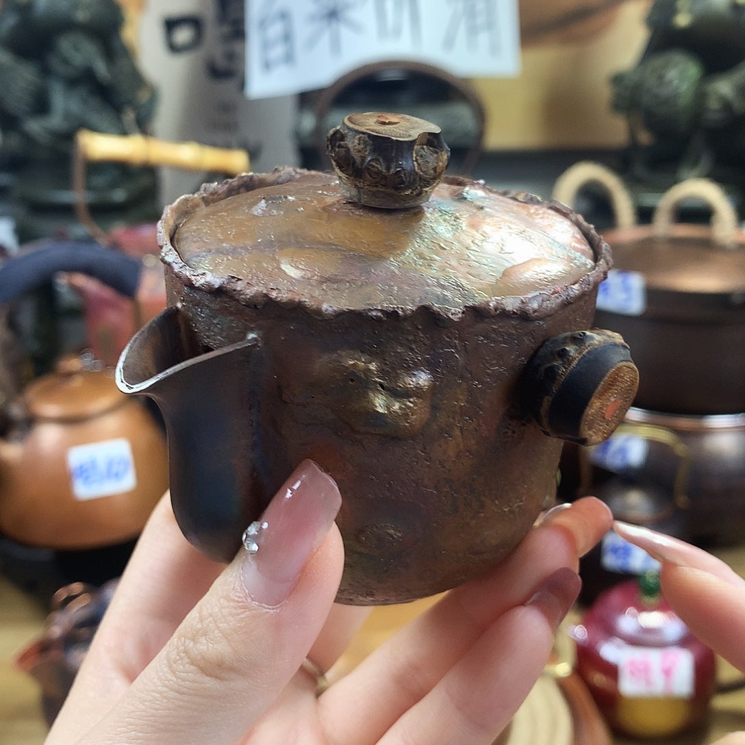 诧极风手抓壶纯铜999
